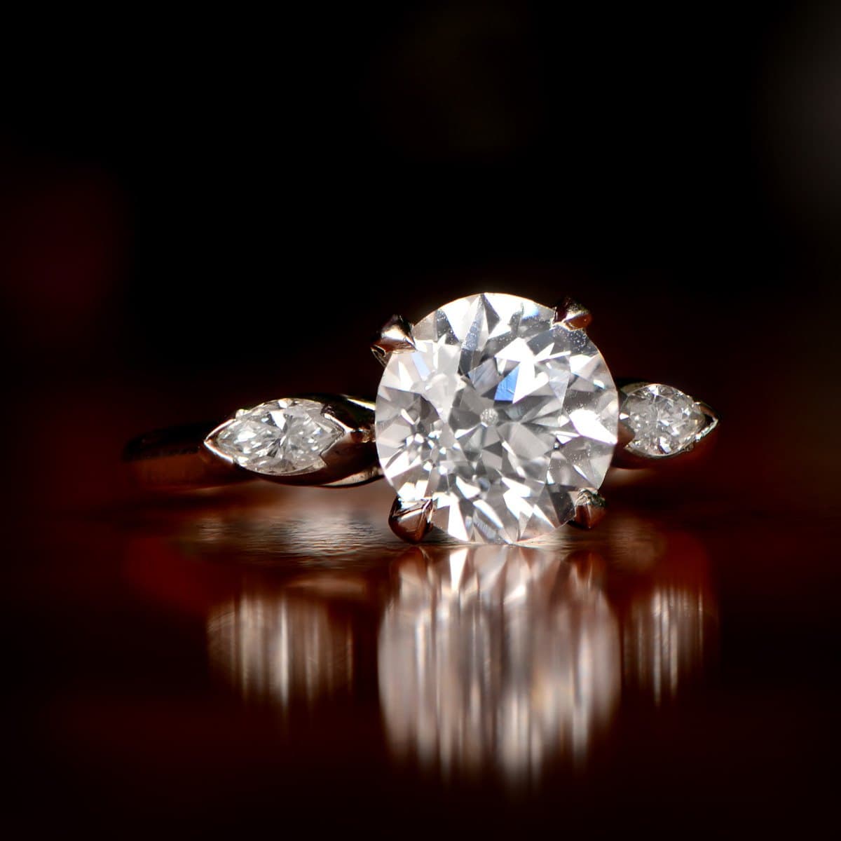 Natural three-stone ring — round & marquise